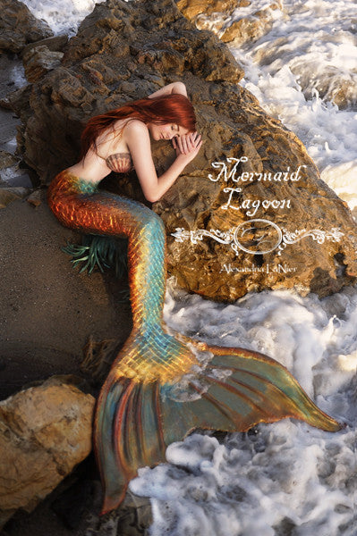Painting of an Irish mermaid laying on a rock formation by the sea